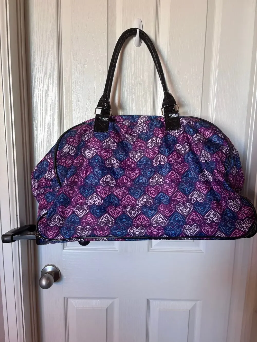 Kathy Van Zeeland 22-inch rolling weekender duffle bag.